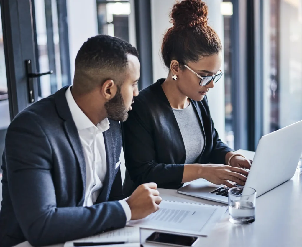 Lawyer, paralegal and typing court filing for client contract, teamwork or strategy